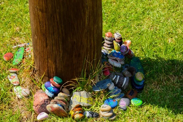 Painted rocks around a pole