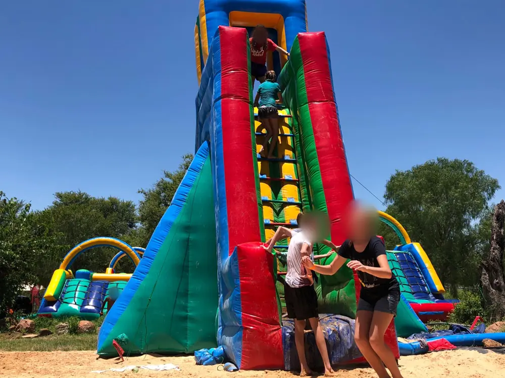 Kids on a giant inflatable slide