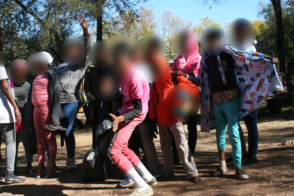 Kids showing off new warm blankets