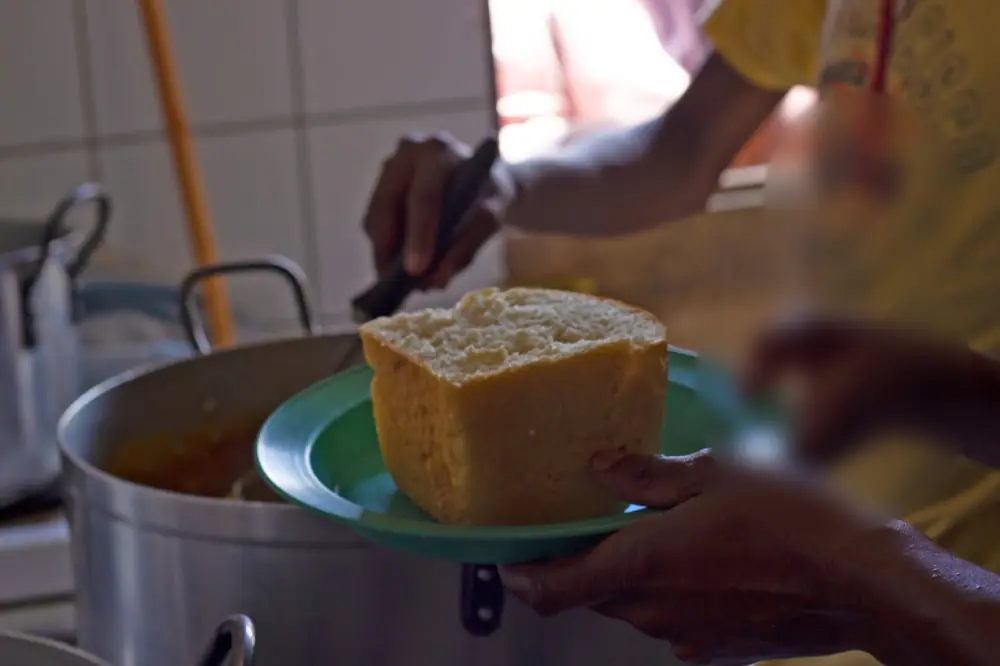 A plate of fresh bread being served