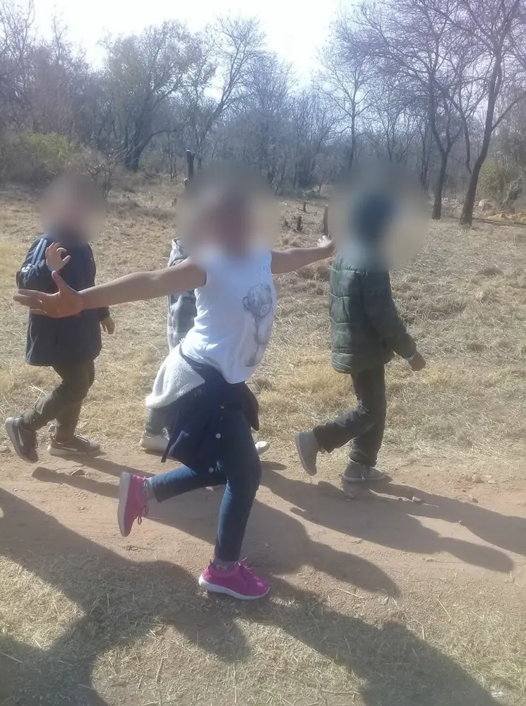 A girl dancing outside at camp
