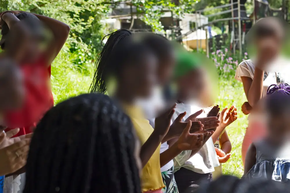 Girls clapping and singing together